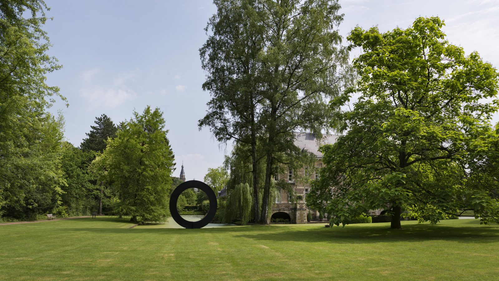 A modern art sculpture at the Kasteel Wijlre estate. The circular sculpture stands on the lawn that surrounds the mansion
